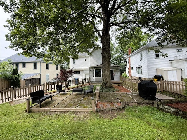 566 Walnut St, Meadville, PA 16335 - fenced backyard featuring a patio area and a storage shed