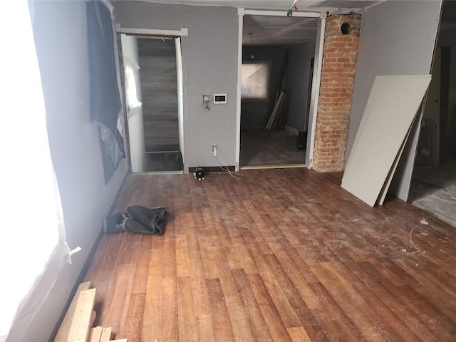 empty room with wood finished floors