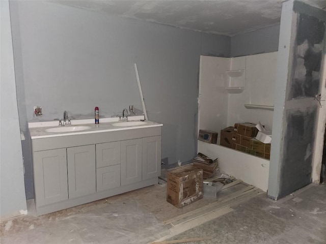 full bathroom featuring a shower and a sink