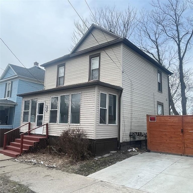 view of front of home featuring a gate