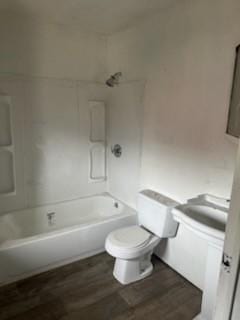 513 Wallace St, Erie, PA 16507 - full bathroom with toilet, wood finished floors, and shower / bathing tub combination