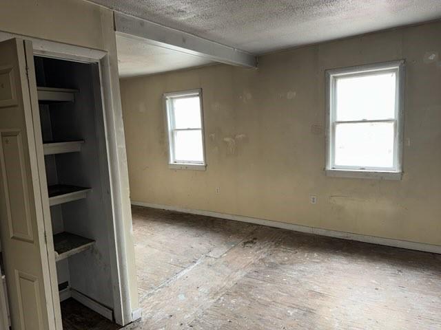513 Wallace St, Erie, PA 16507 - spare room featuring a textured ceiling