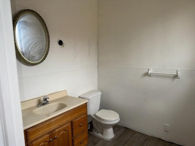 513 Wallace St, Erie, PA 16507 - bathroom with toilet, vanity, and wood finished floors