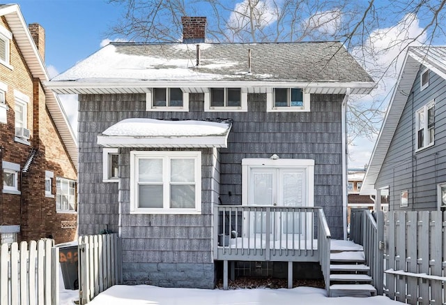 view of front facade with a wooden deck