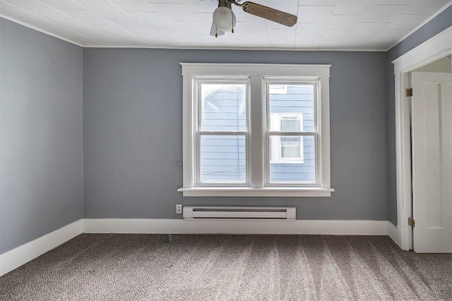 carpeted spare room with crown molding and ceiling fan