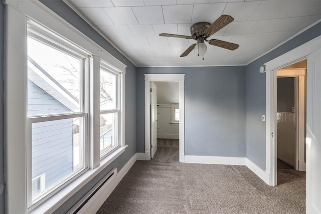 unfurnished bedroom with multiple windows, carpet floors, and ceiling fan