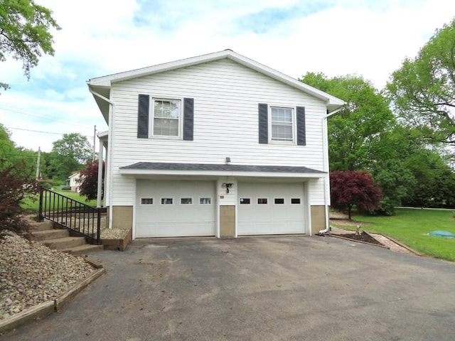 12930 Park Lane Dr, Meadville, PA 16335 - view of side of property with asphalt driveway and a garage