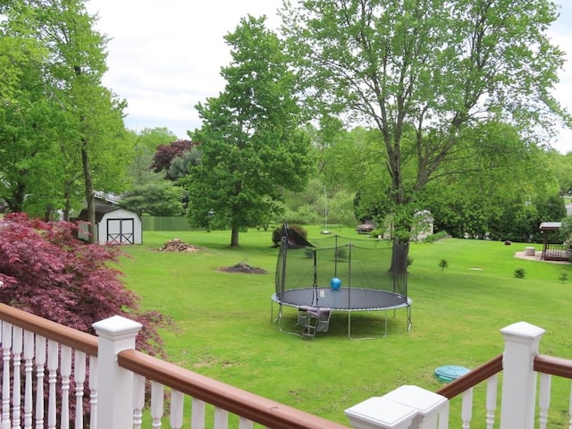 12930 Park Lane Dr, Meadville, PA 16335 - view of green lawn with a trampoline and view of wooded area