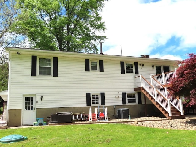 12930 Park Lane Dr, Meadville, PA 16335 - back of property featuring central air condition unit, stairway, a yard, and a wooden deck