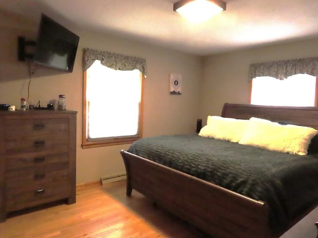12930 Park Lane Dr, Meadville, PA 16335 - bedroom with a baseboard radiator and light wood-style floors