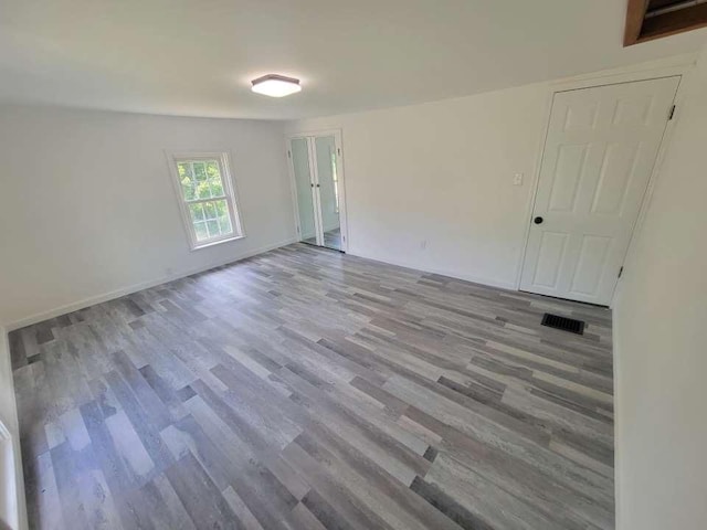 unfurnished room with light hardwood / wood-style flooring