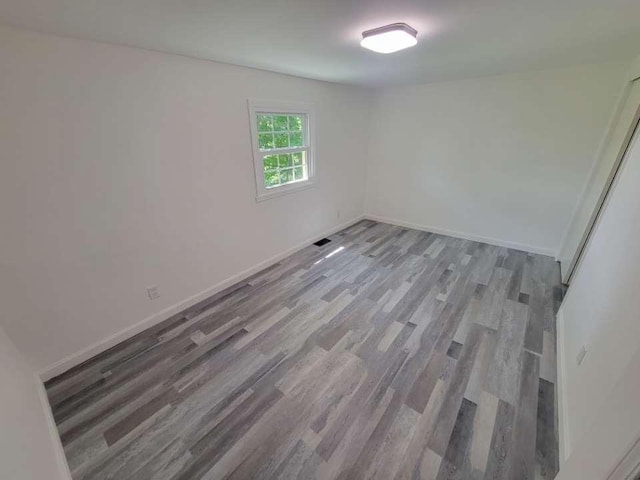 empty room featuring hardwood / wood-style floors