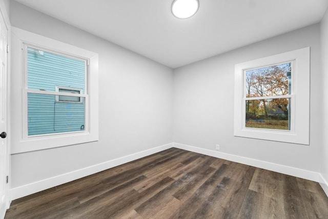 unfurnished room featuring dark hardwood / wood-style flooring