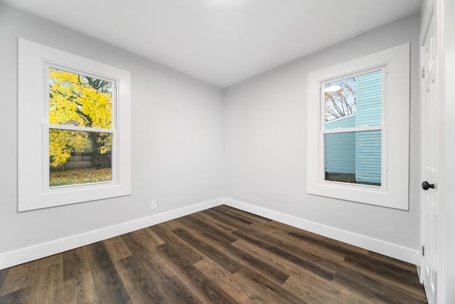 empty room featuring dark hardwood / wood-style flooring