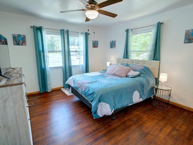 6620 W Ridge Rd, Fairview, PA 16415 - bedroom with multiple windows, baseboards, wood finished floors, and a ceiling fan