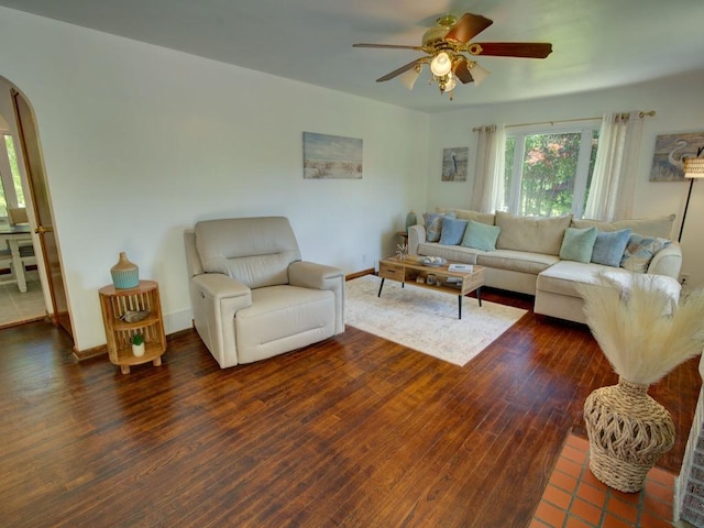 6620 W Ridge Rd, Fairview, PA 16415 - living room featuring a ceiling fan, wood finished floors, baseboards, and arched walkways