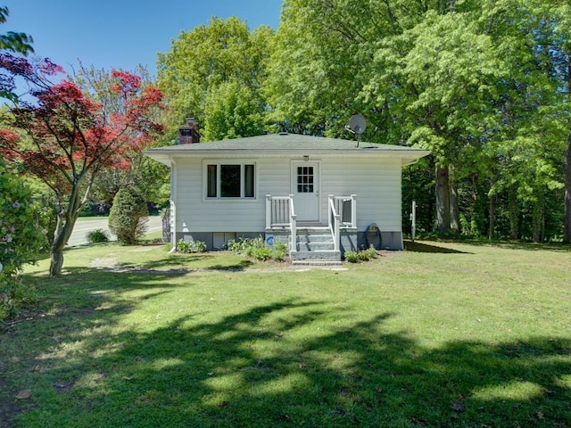 6620 W Ridge Rd, Fairview, PA 16415 - rear view of house featuring a yard and a chimney