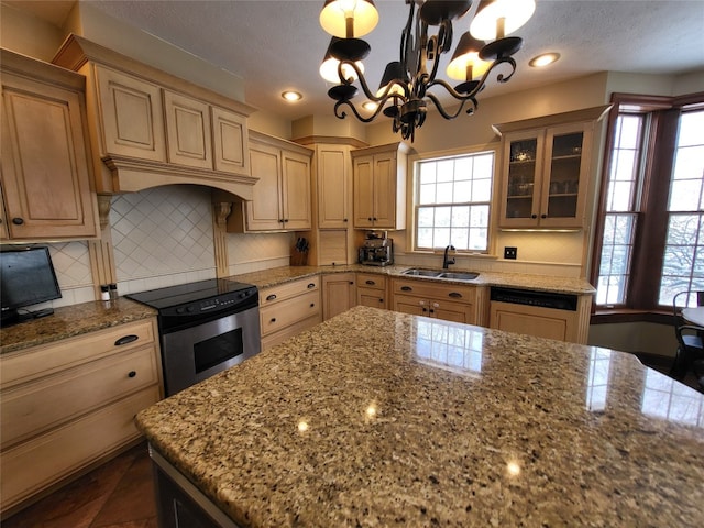 kitchen with tasteful backsplash, stainless steel electric stove, dishwasher, an inviting chandelier, and a sink