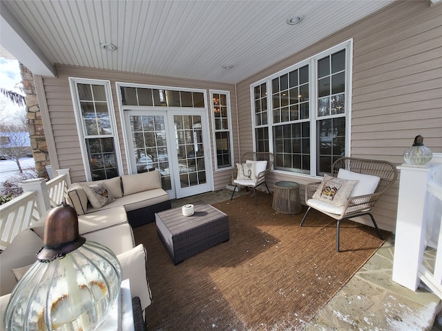 view of patio with a deck, an outdoor living space, and french doors