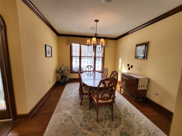 dining space with baseboards, an inviting chandelier, dark wood-style flooring, and crown molding