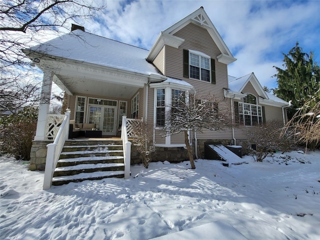 traditional-style home featuring covered porch