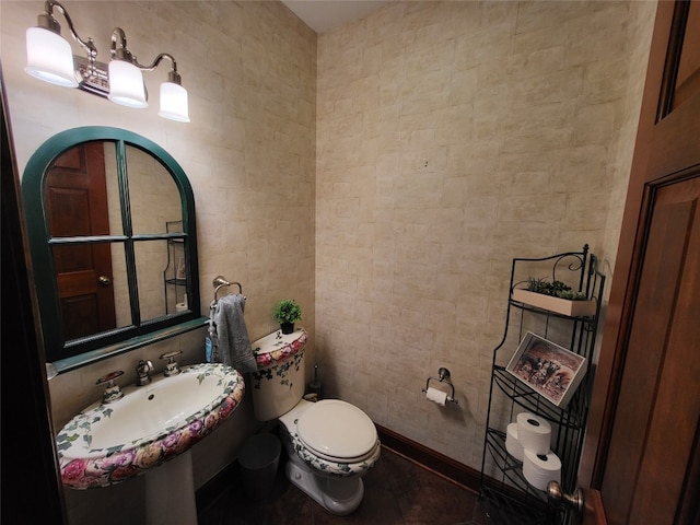 half bathroom with tile walls and toilet