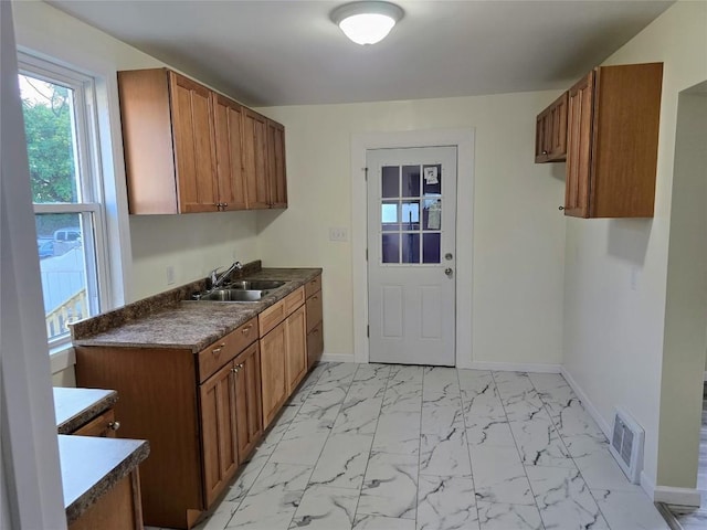 922 E 9th St, Erie, PA 16503 - laundry room with a sink and light marble finish floors