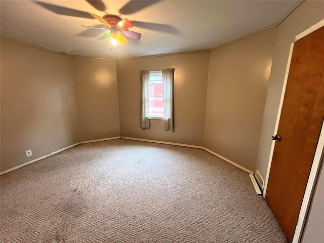 carpeted empty room featuring ceiling fan