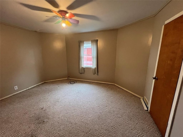 spare room with ceiling fan and light colored carpet