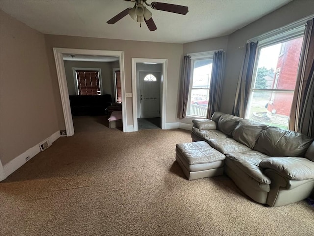 living room with carpet flooring and ceiling fan