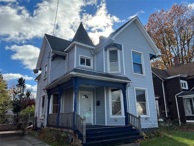 victorian house featuring a porch