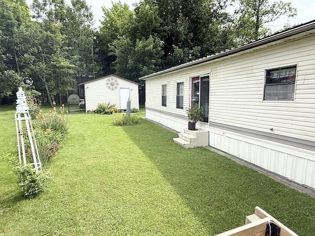 702 Skyline Dr, Mckean, PA 16426 - view of green lawn with entry steps and a storage unit