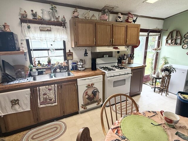 702 Skyline Dr, Mckean, PA 16426 - kitchen with white appliances, extractor fan, a textured ceiling, light flooring, and ornamental molding
