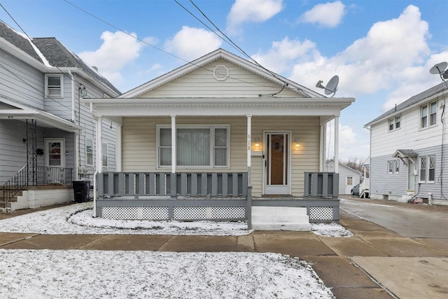 view of front of house featuring driveway and covered porch