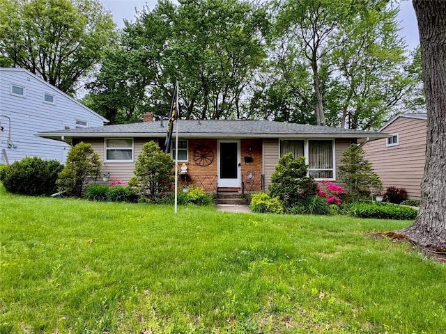 1426 W 45th St, Erie, PA 16509 - view of front of house featuring a front yard and a chimney
