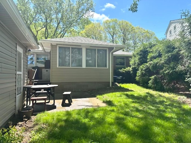 1426 W 45th St, Erie, PA 16509 - rear view of property featuring a yard and a patio