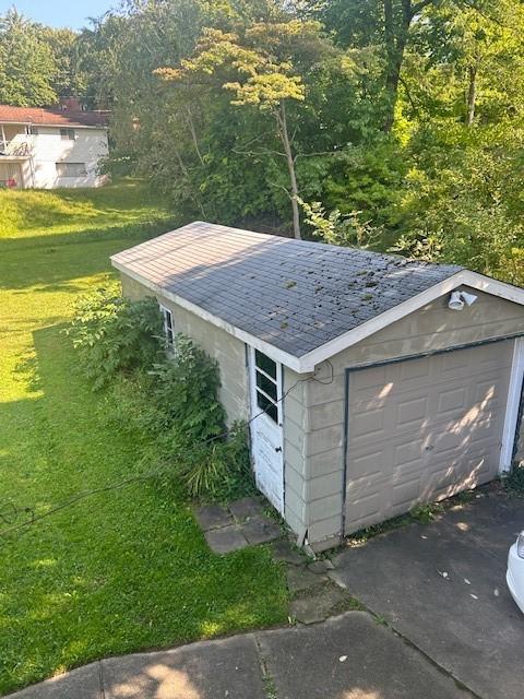 garage featuring a yard