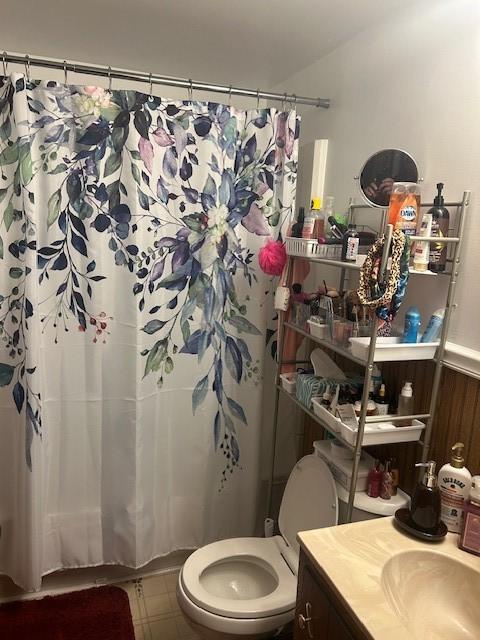 bathroom featuring vanity and toilet