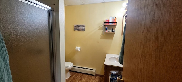 9990 Findley Lake Rd, North East, PA 16428 - bathroom featuring baseboard heating, an enclosed shower, wood finished floors, and vanity