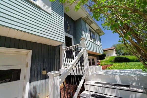 view of side of property featuring a wooden deck