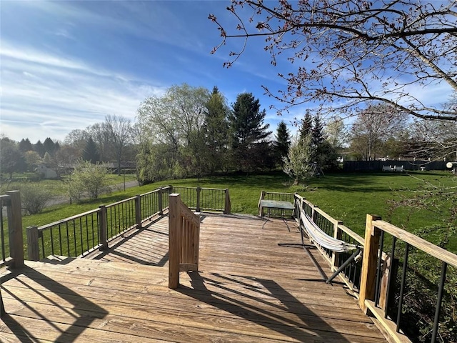 wooden terrace with a yard
