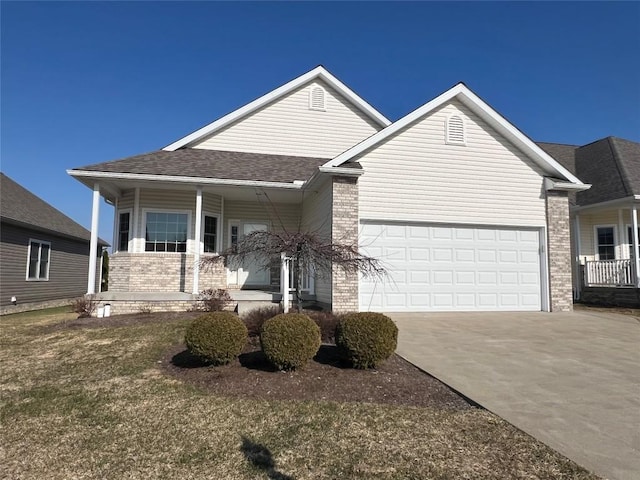 single story home featuring brick siding, a shingled roof, a porch, concrete driveway, and a garage