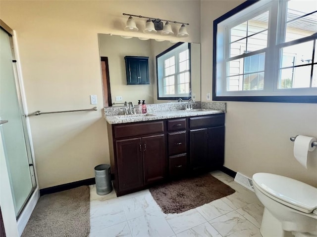 full bathroom featuring marble finish floor, toilet, baseboards, and a sink