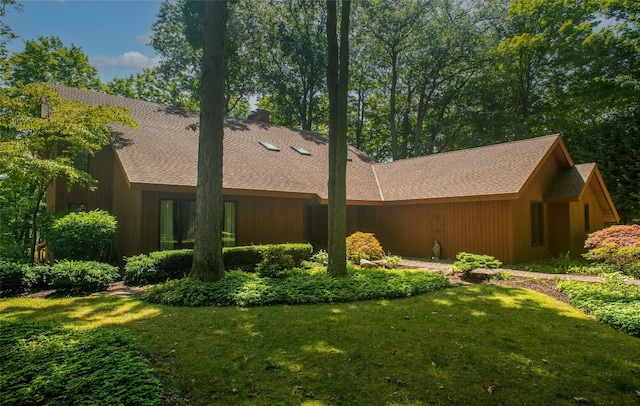 view of home's exterior featuring a yard