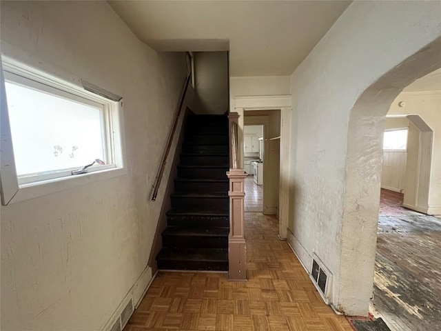 staircase with parquet floors