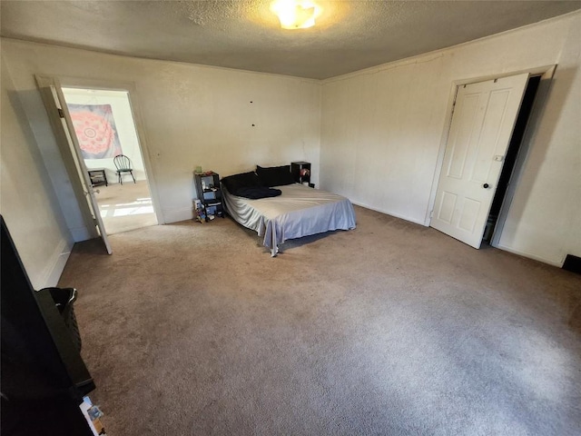 carpeted bedroom featuring a textured ceiling