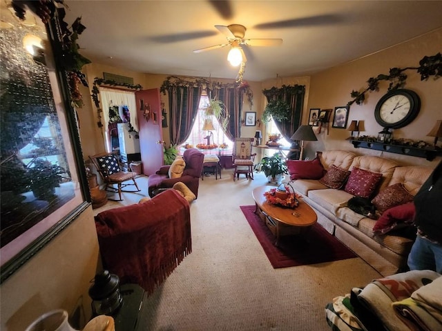 living room featuring carpet and ceiling fan