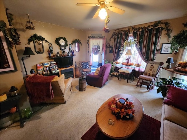 living room featuring carpet flooring and ceiling fan