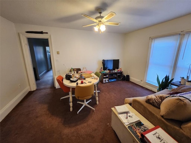 carpeted living room with ceiling fan