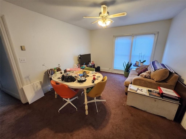 carpeted dining space featuring ceiling fan